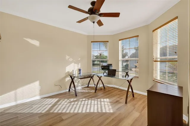 a living room with furniture a table and a window