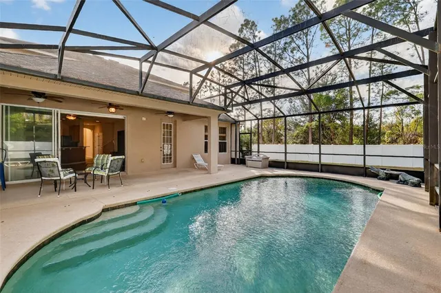 a view of a swimming pool with a patio