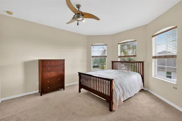 a bed room with a bed and a window