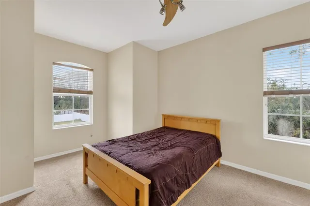 a bedroom with a bed and window