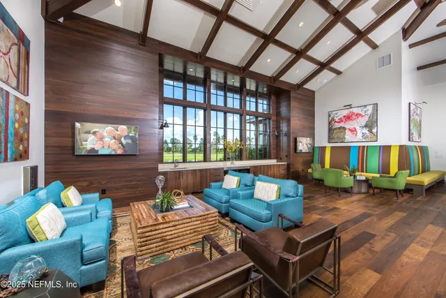 a view of swimming pool with sitting area