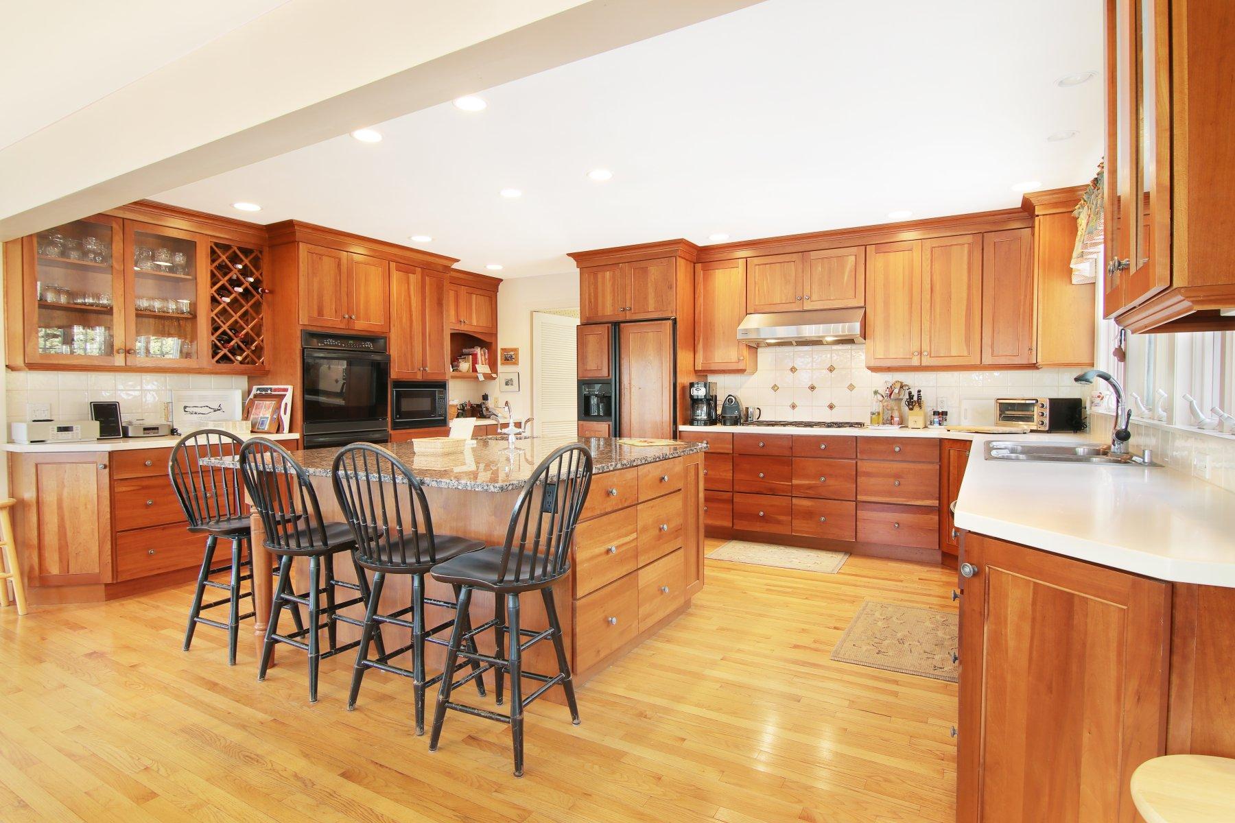 16 Thayer Lane Orleans, MA 02653 - Photo 15 of 35 a large kitchen with a table and chairs