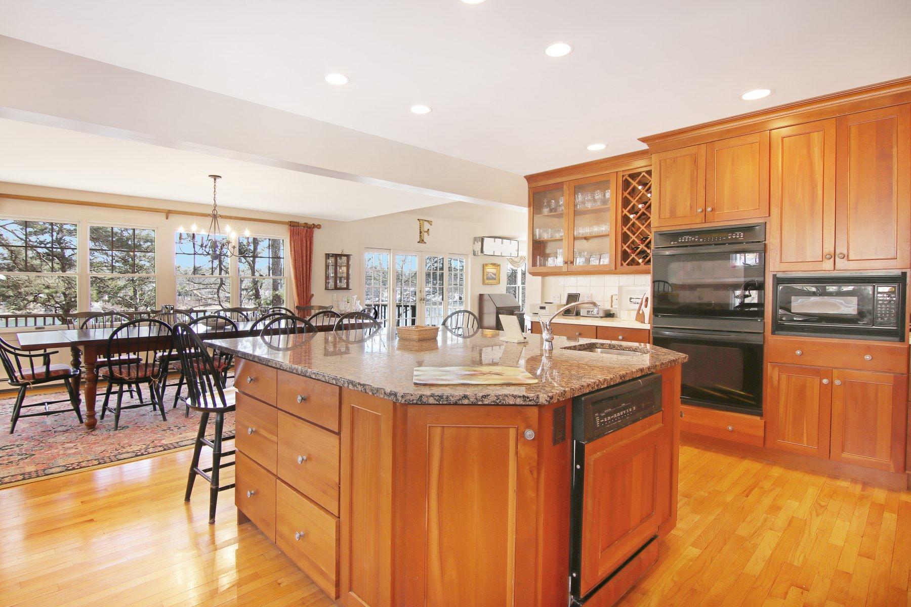 16 Thayer Lane Orleans, MA 02653 - Photo 17 of 35 a kitchen with stainless steel appliances granite countertop a stove and cabinets