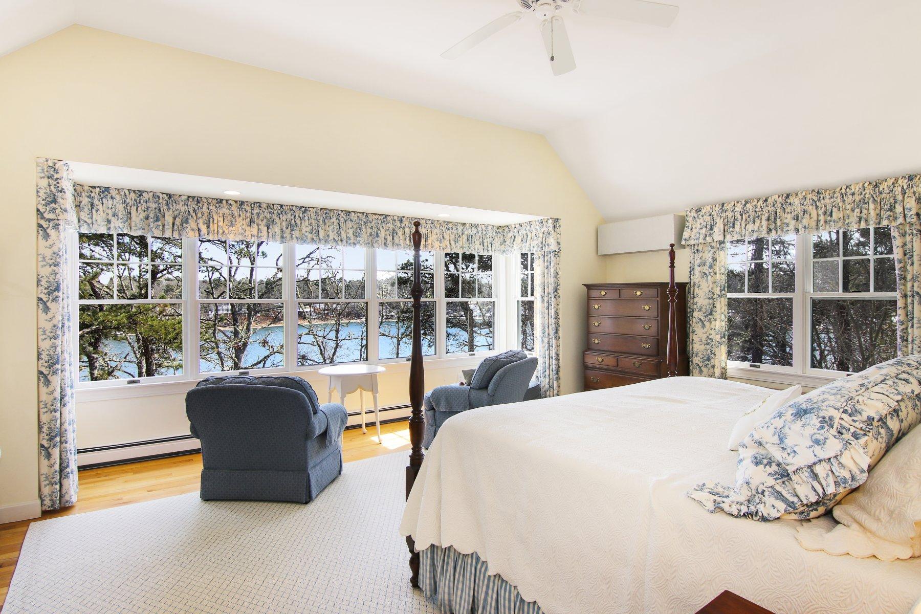 16 Thayer Lane Orleans, MA 02653 - Photo 18 of 35 a bedroom with a bed and a large window