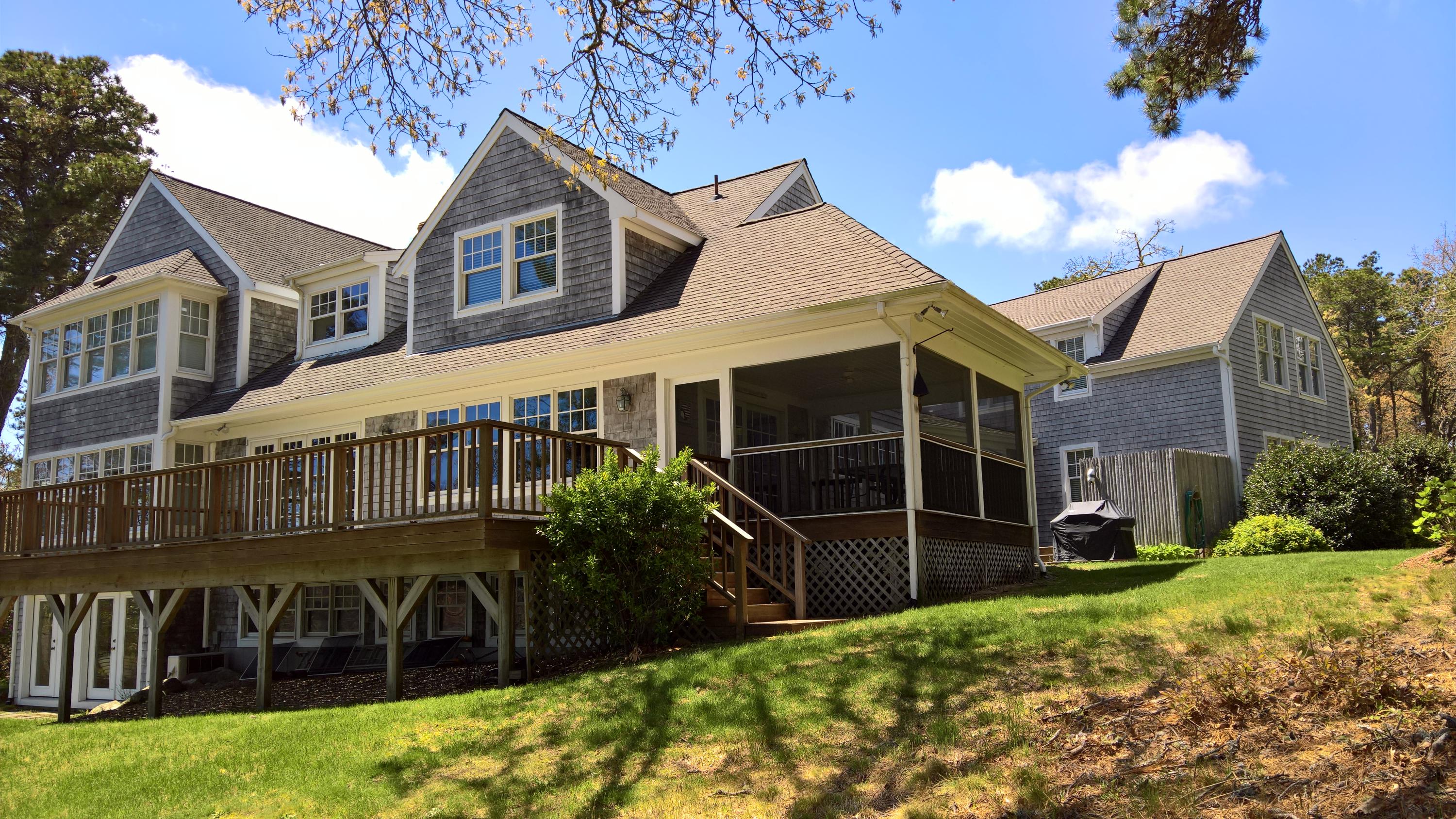16 Thayer Lane Orleans, MA 02653 - Photo 23 of 35 a view of a house with a yard and sitting area