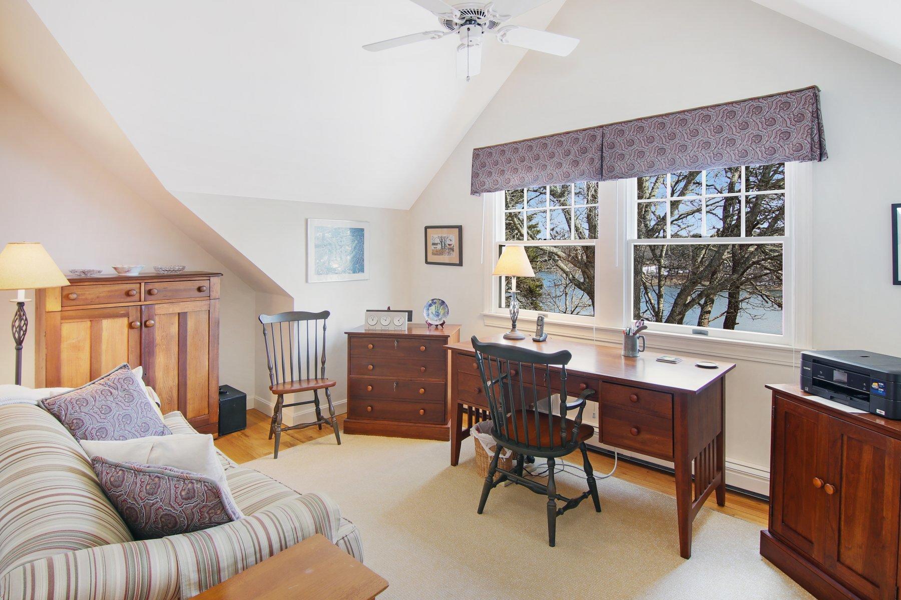 16 Thayer Lane Orleans, MA 02653 - Photo 32 of 35 a living room with furniture a large window and a potted plant