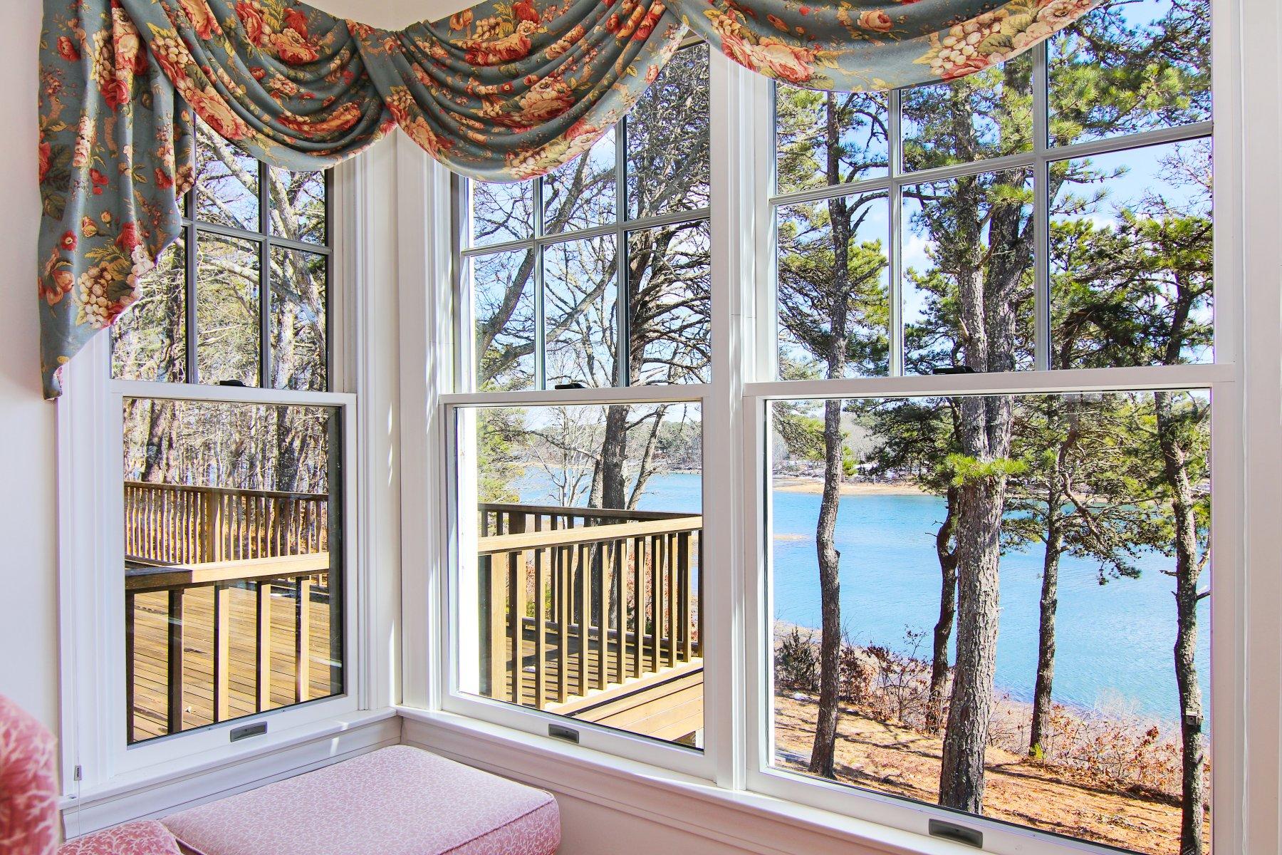 16 Thayer Lane Orleans, MA 02653 - Photo 9 of 35 a front view of a house with a glass door