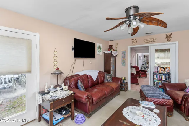 a kitchen with a refrigerator and a stove top oven
