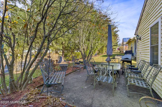 a view of a backyard with a tree