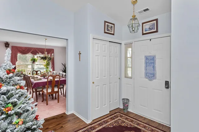 a view of a hallway and dining room