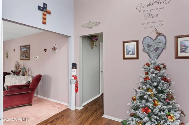 a view of a hallway with paintings on the walls