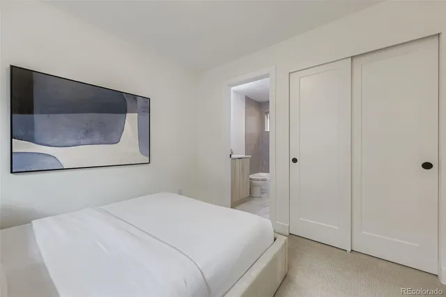a bedroom with a bed and a microwave