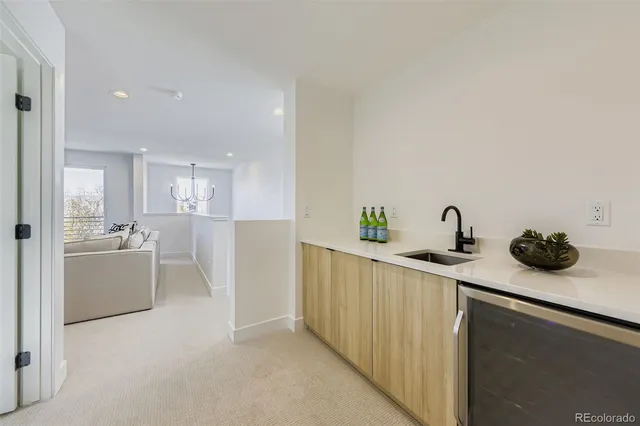 a kitchen with refrigerator and cabinets
