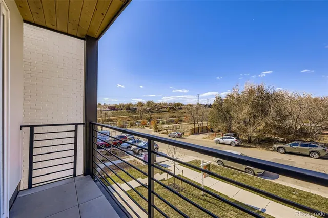 a view of a large building with mountains in the background