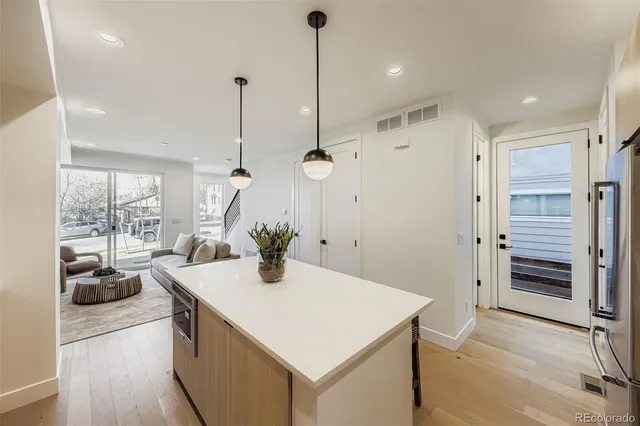 a very nice looking room with a large window and wooden floor