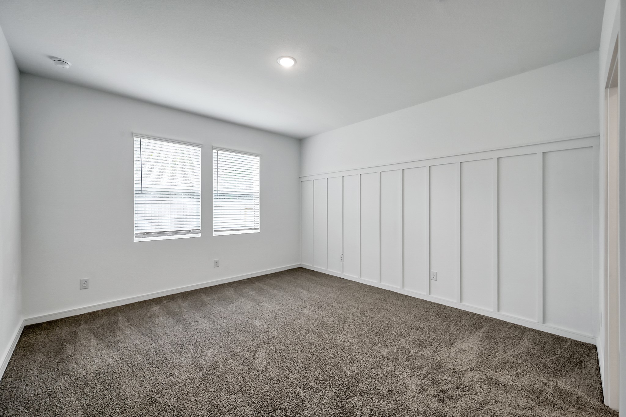 516 Monarch Trail Huntsville, TX 77340 - Photo 12 of 20 an empty room with windows
