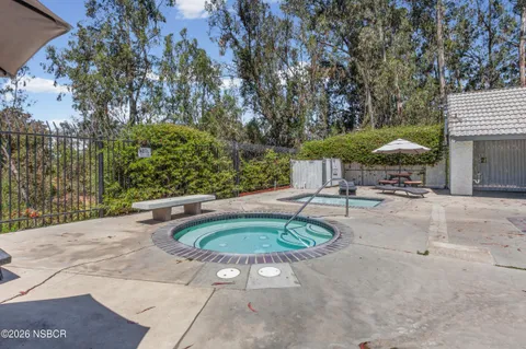 a backyard of a house with outdoor seating