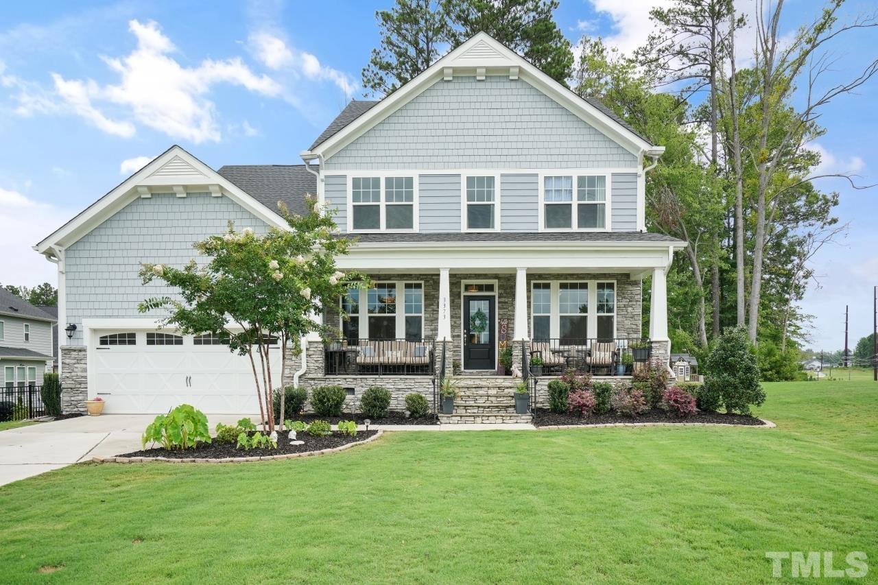 3373 Willow Green Drive Apex, NC 27502 - Photo 1 of 42 a front view of a house with a yard