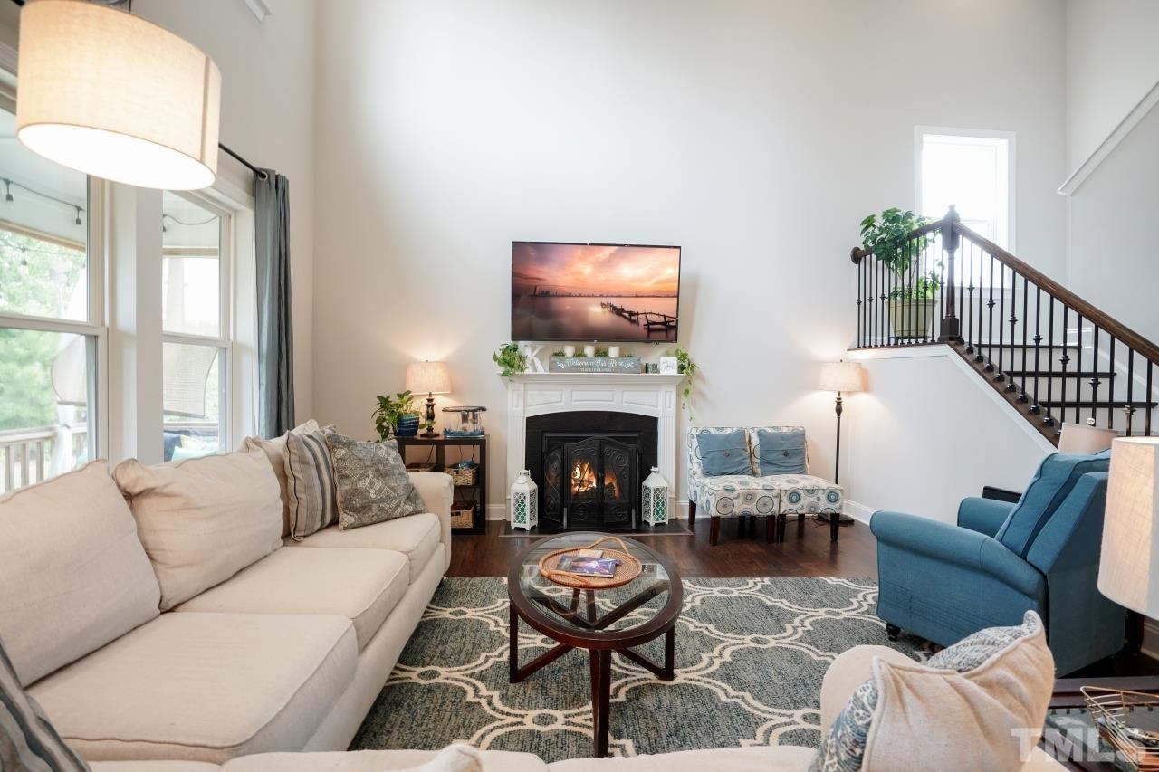 3373 Willow Green Drive Apex, NC 27502 - Photo 12 of 42 a living room with furniture a fireplace and window