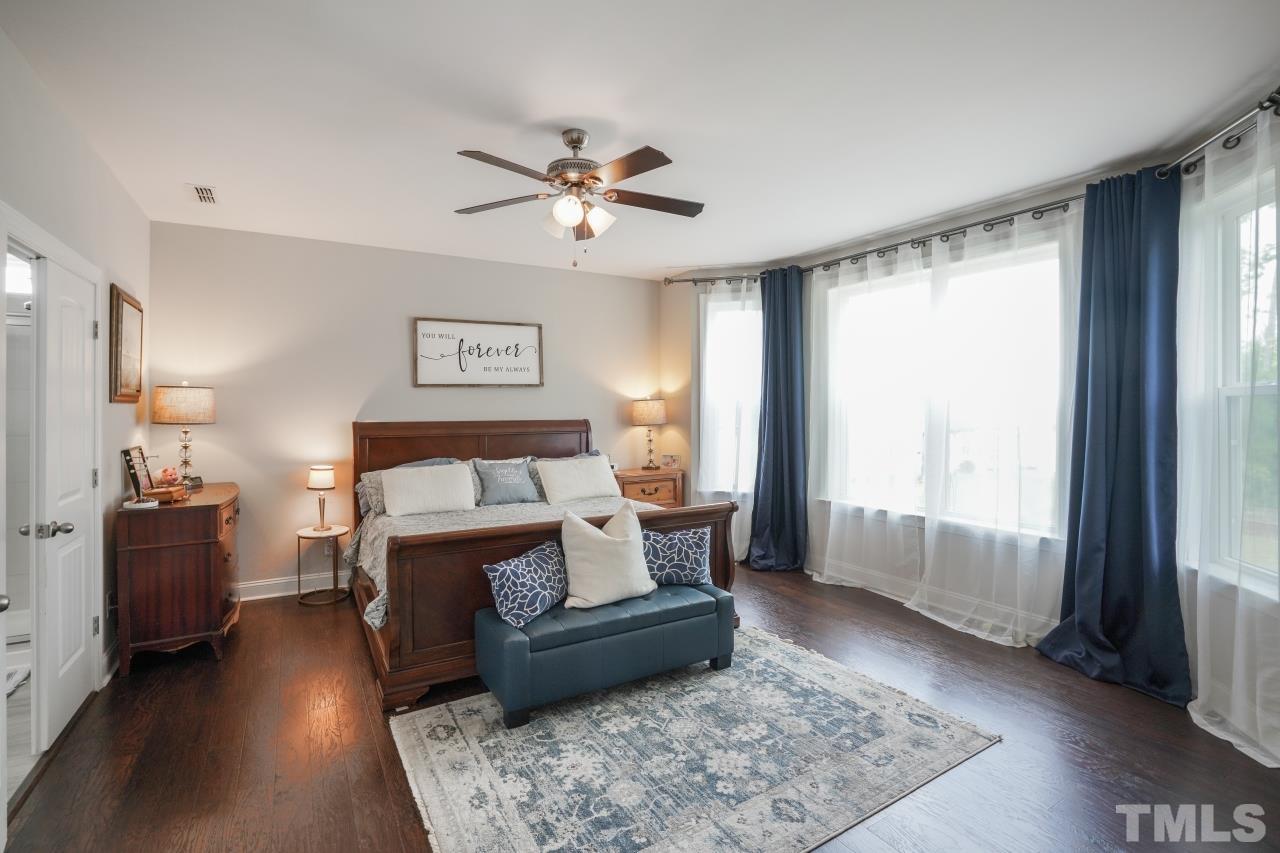 3373 Willow Green Drive Apex, NC 27502 - Photo 16 of 42 a bed room with a bed and a window