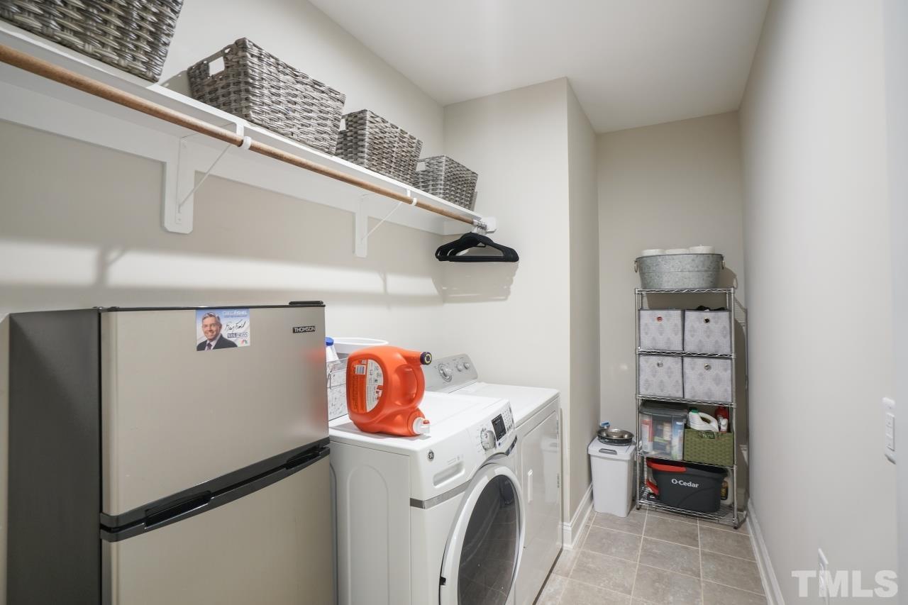 3373 Willow Green Drive Apex, NC 27502 - Photo 23 of 42 a utility room with dryer and washer