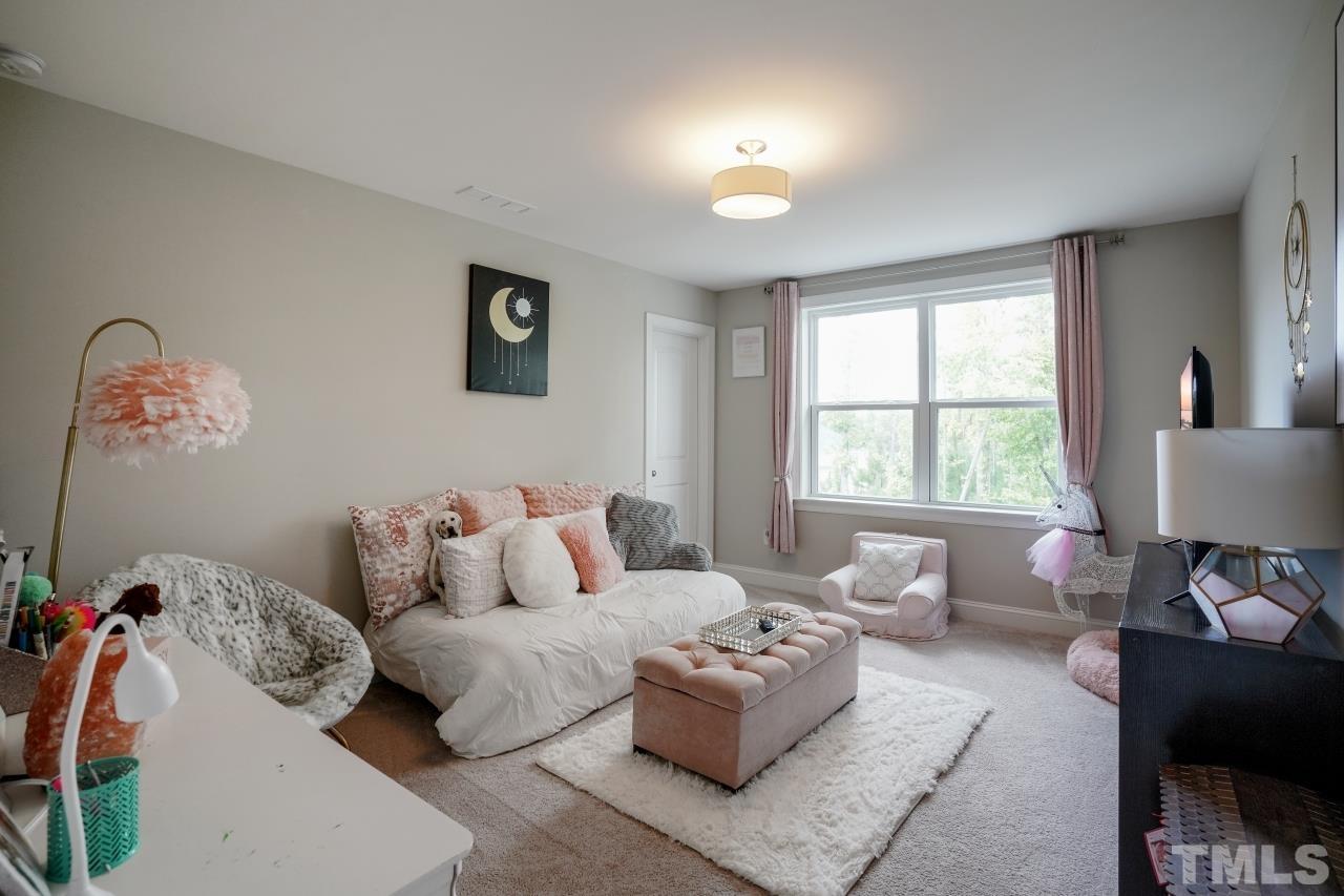 3373 Willow Green Drive Apex, NC 27502 - Photo 28 of 42 a bedroom with furniture and a window