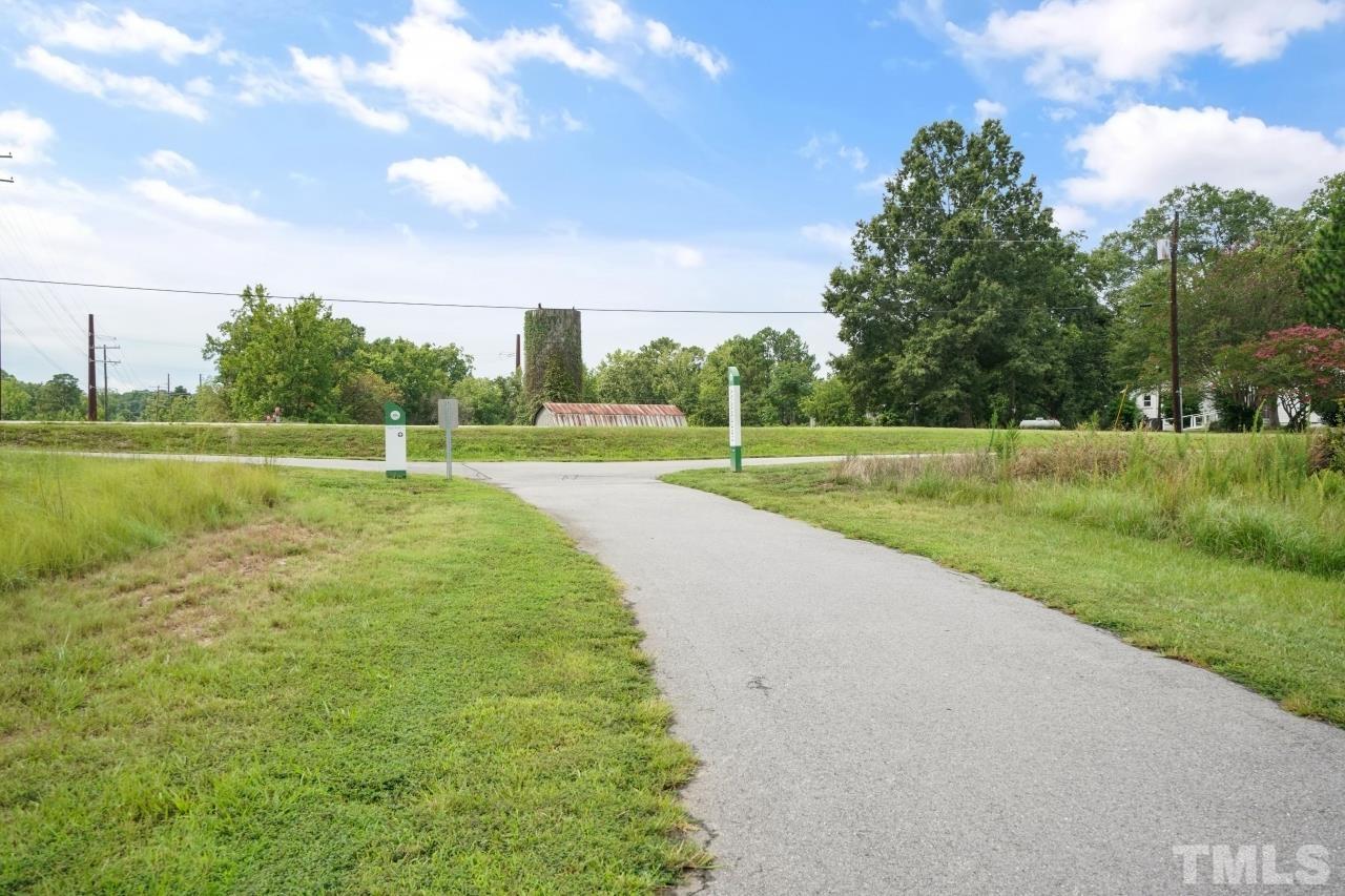 3373 Willow Green Drive Apex, NC 27502 - Photo 39 of 42 a view of a golf course with a lake