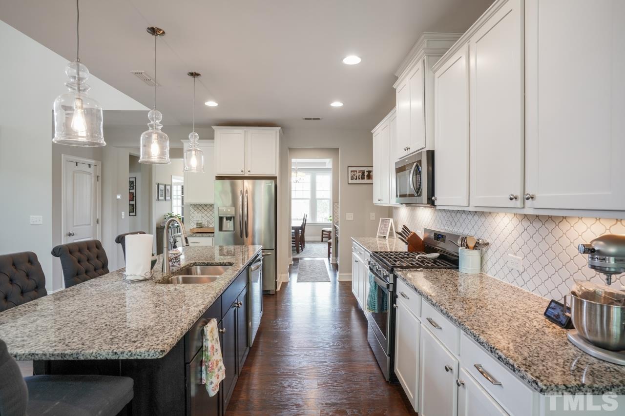 3373 Willow Green Drive Apex, NC 27502 - Photo 8 of 42 a kitchen with granite countertop lots of counter top space