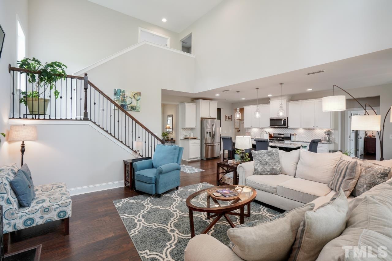 3373 Willow Green Drive Apex, NC 27502 - Photo 10 of 42 a living room with furniture kitchen view and a potted plant