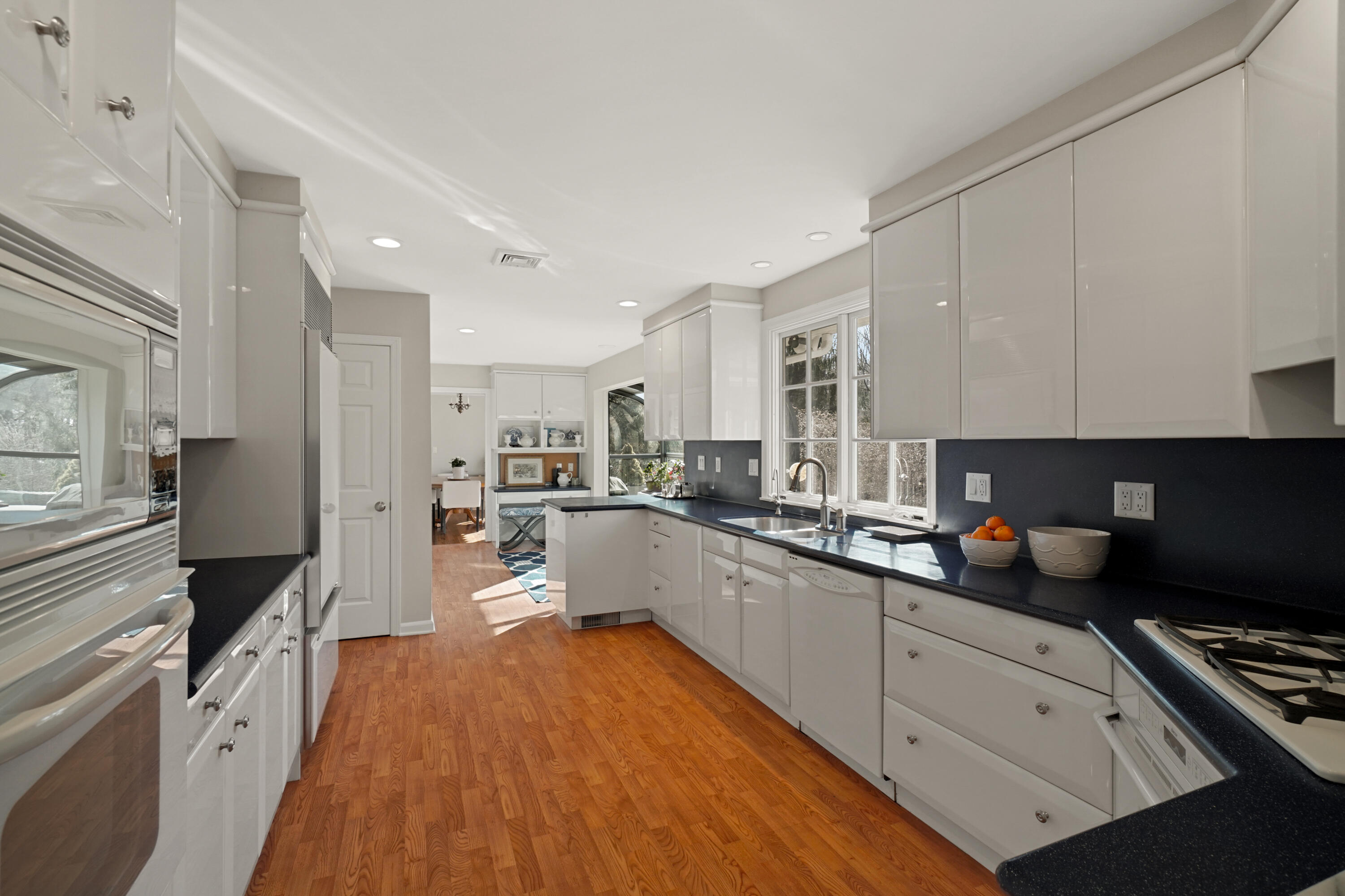 102 Ludlowe Road New Canaan, CT 06840 - Photo 23 of 42 a kitchen with white cabinets and appliances