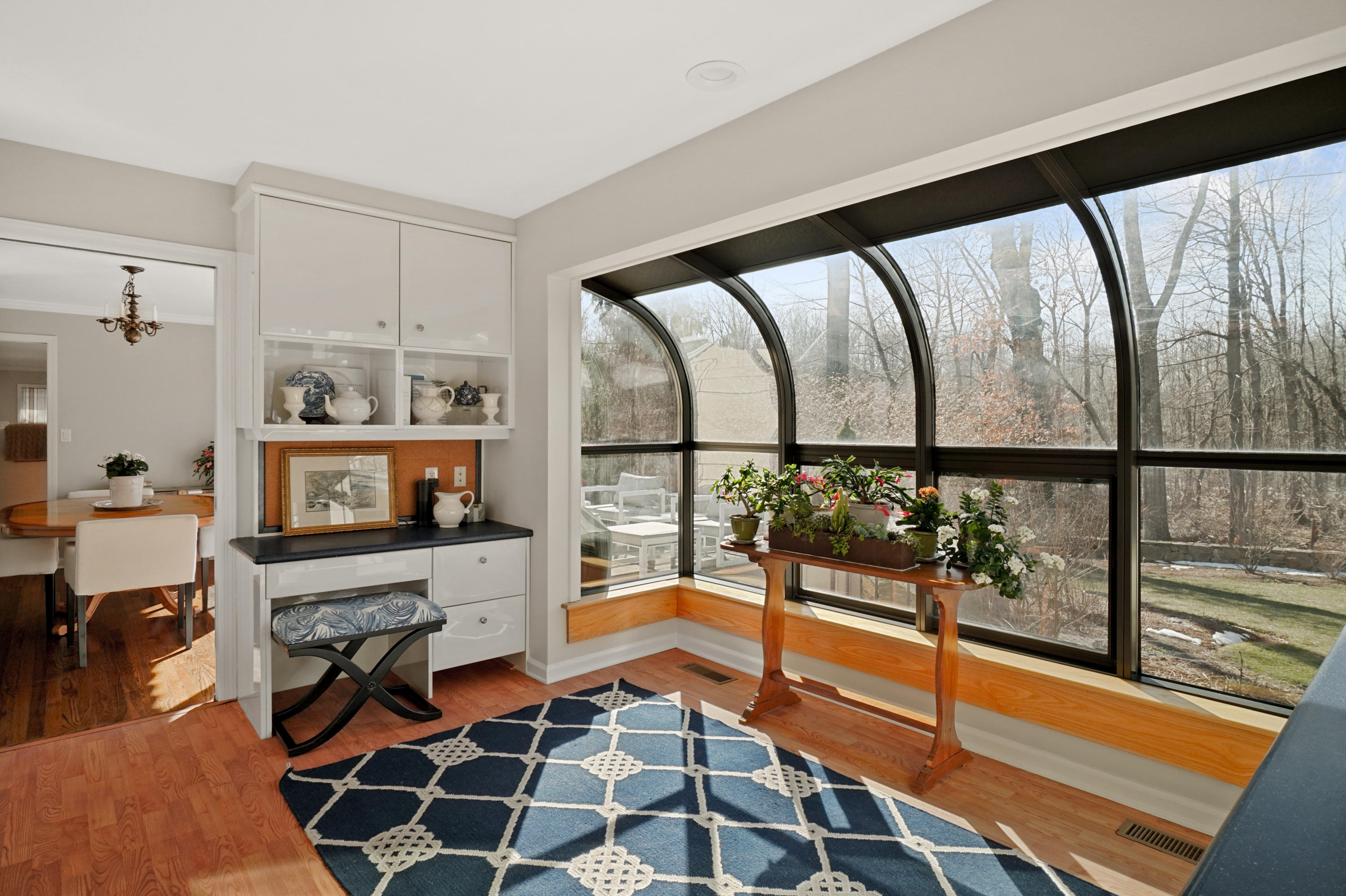 102 Ludlowe Road New Canaan, CT 06840 - Photo 25 of 42 a picture of a living room with a floor to ceiling window and wooden floor