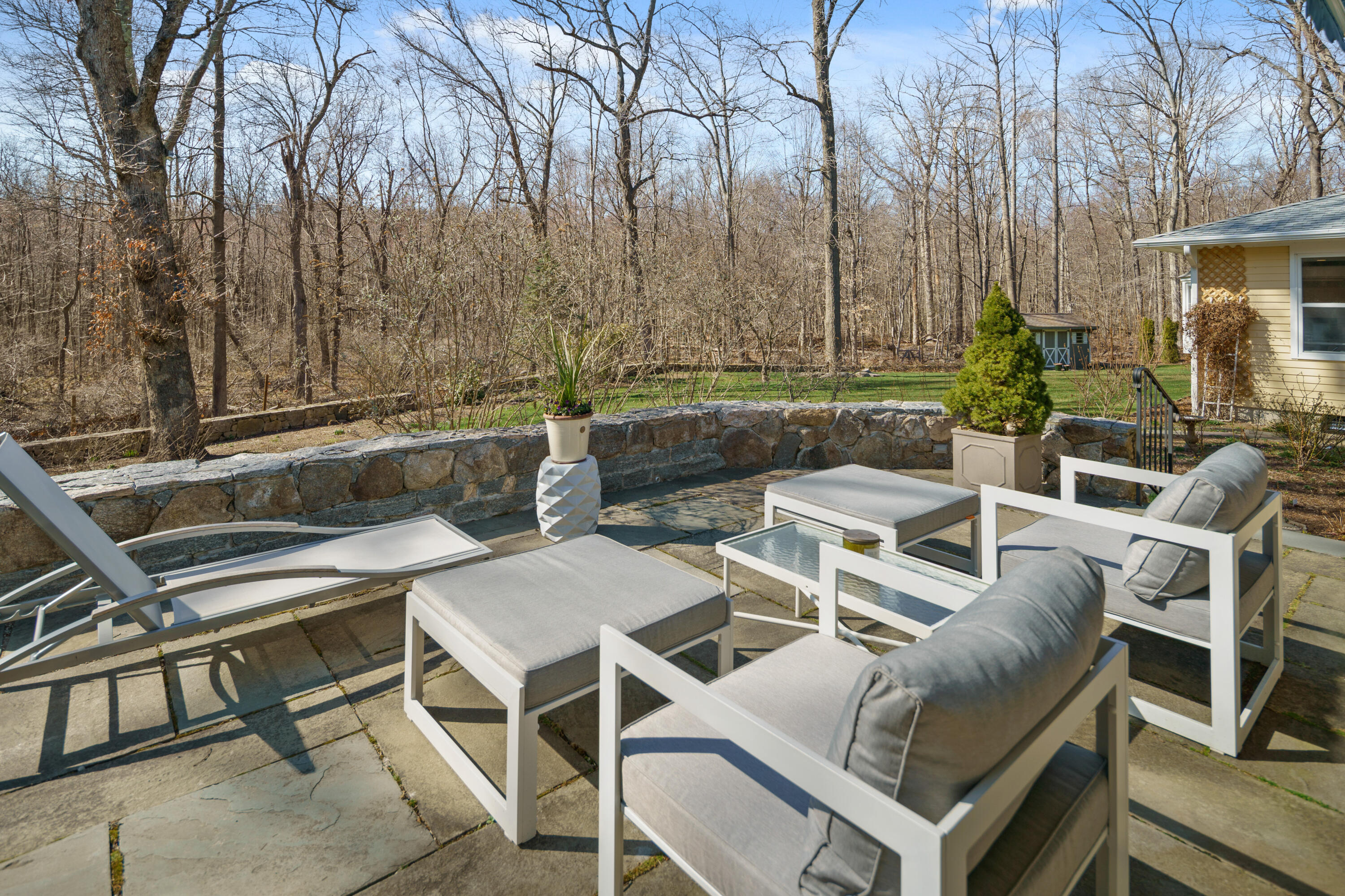 102 Ludlowe Road New Canaan, CT 06840 - Photo 4 of 42 a view of a chairs and table in the patio