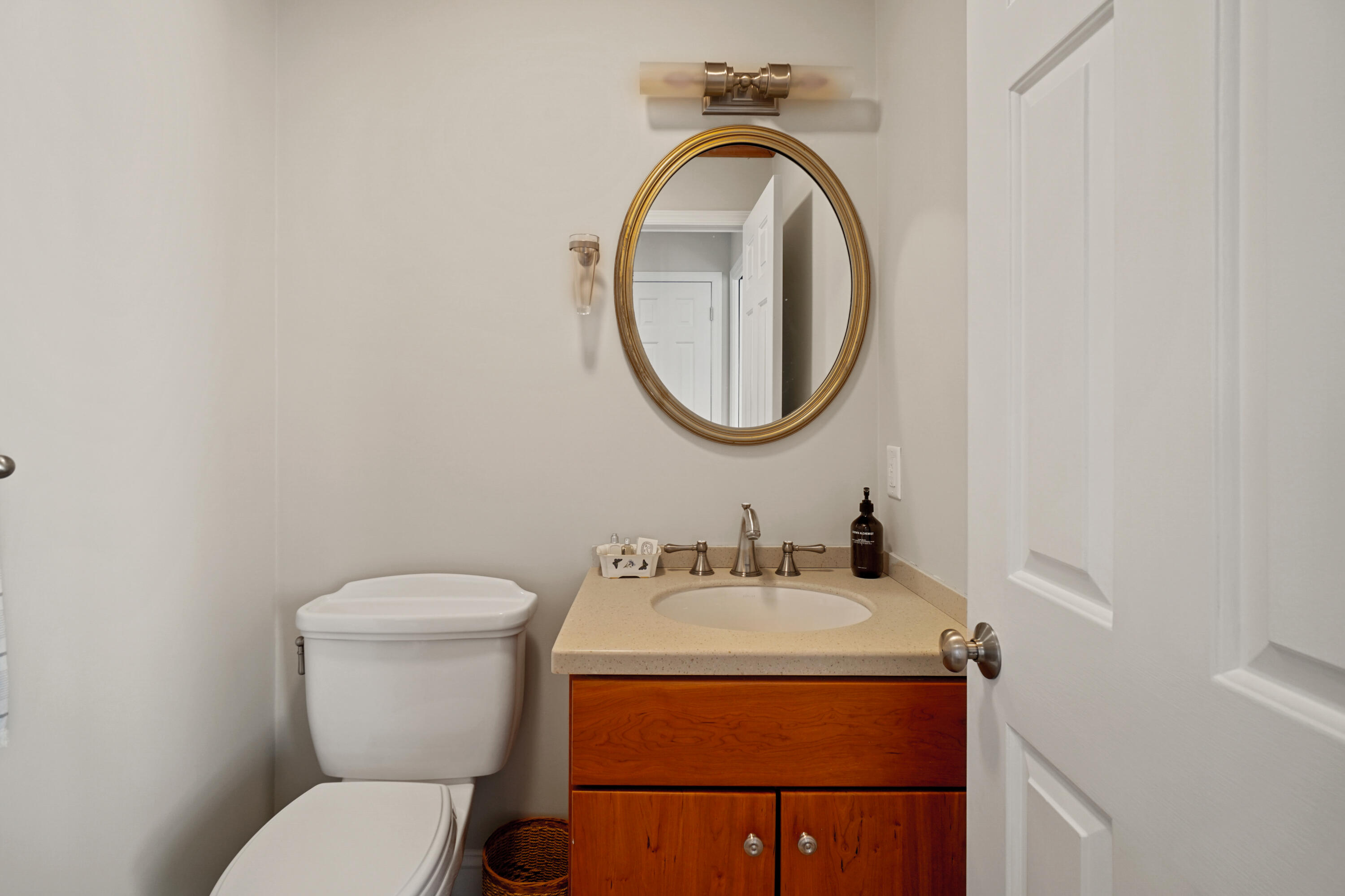 102 Ludlowe Road New Canaan, CT 06840 - Photo 35 of 42 a bathroom with a toilet sink and mirror