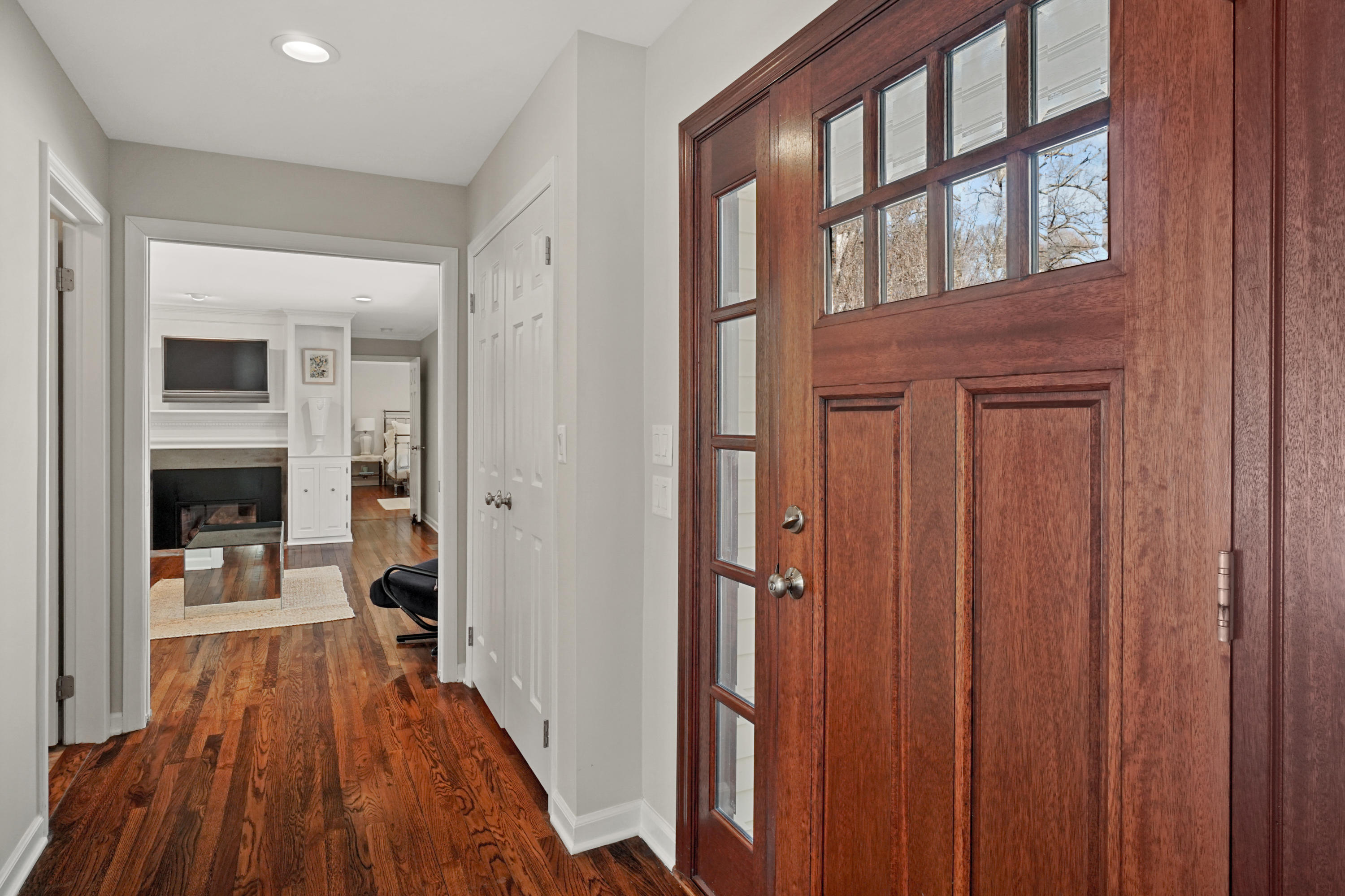 102 Ludlowe Road New Canaan, CT 06840 - Photo 7 of 42 a view of a hallway with wooden floor and a fireplace