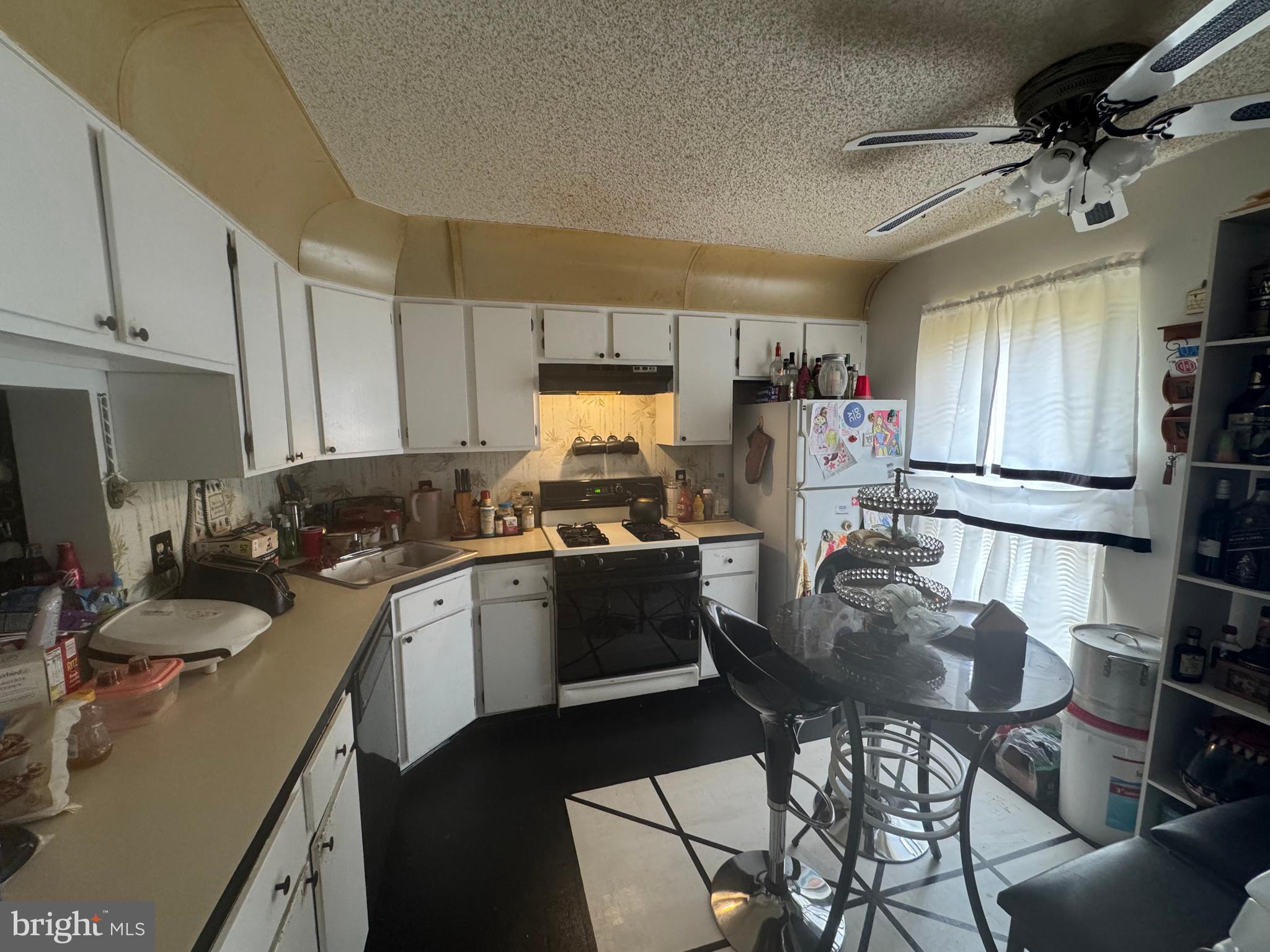 172 Mattix Run Absecon, NJ 08205 - Photo 2 of 9 a kitchen with a sink stove and cabinets