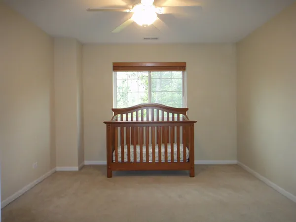 a view of entryway with a chandelier fan