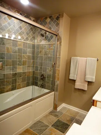 a bathroom with a bathtub and a shower