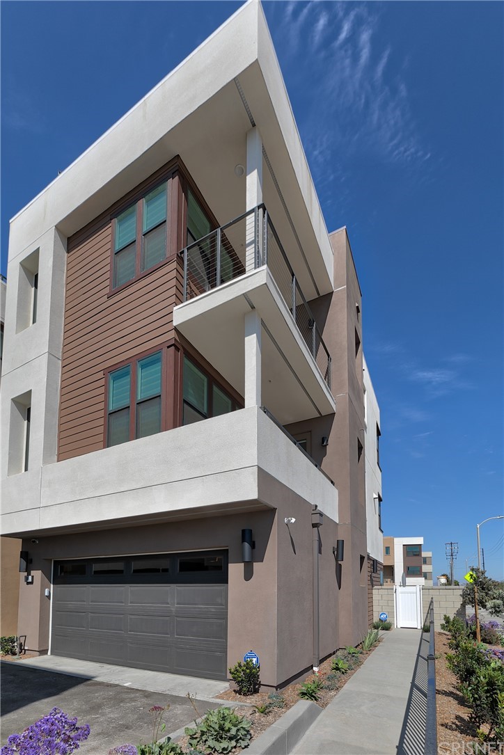 a view of a building with entryway and a building