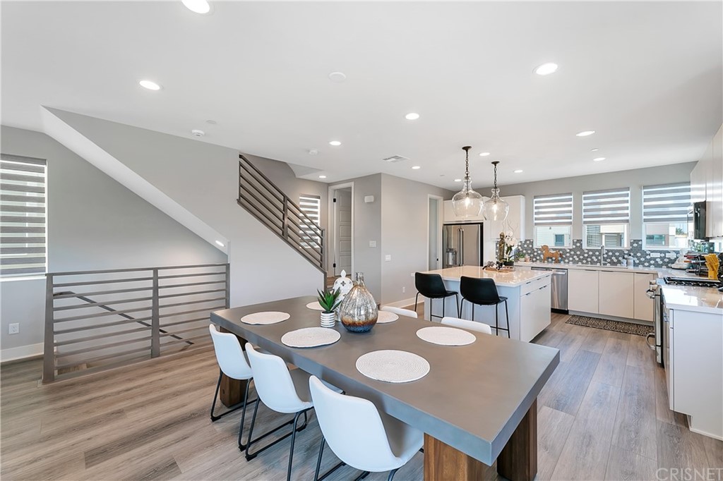 1051 Canal Street Oxnard, CA 93035 - Photo 16 of 37 a open dining room with furniture and wooden floor