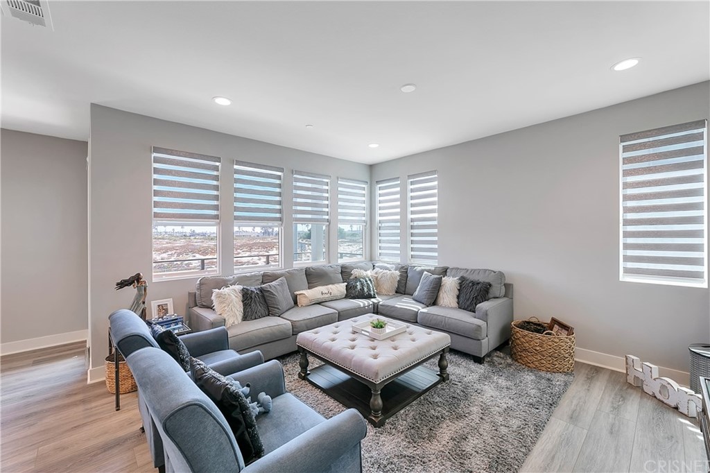 1051 Canal Street Oxnard, CA 93035 - Photo 19 of 37 a living room with furniture and a large window
