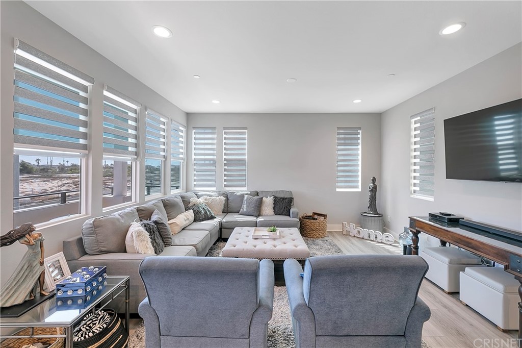 1051 Canal Street Oxnard, CA 93035 - Photo 20 of 37 a living room with furniture and a flat screen tv