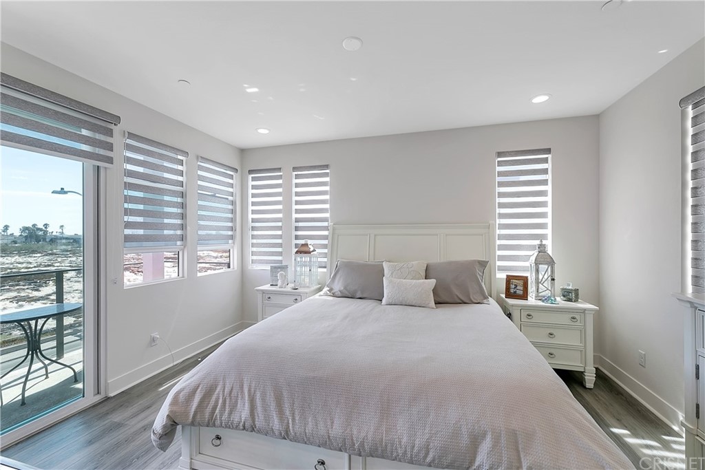 1051 Canal Street Oxnard, CA 93035 - Photo 21 of 37 a bedroom with a large bed and a window