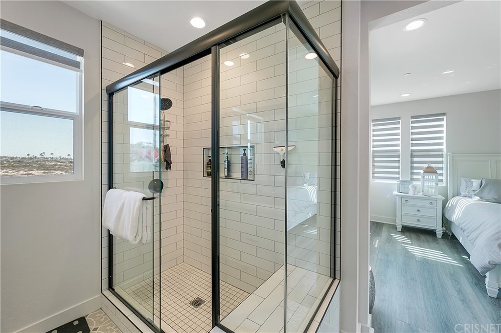 1051 Canal Street Oxnard, CA 93035 - Photo 23 of 37 a bathroom with a bathtub and a shower