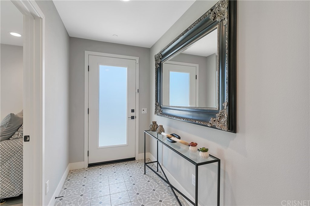 1051 Canal Street Oxnard, CA 93035 - Photo 29 of 37 a bathroom with a sink and a mirror