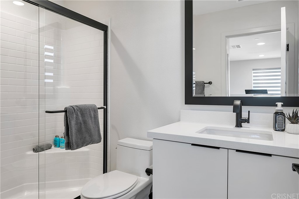 1051 Canal Street Oxnard, CA 93035 - Photo 33 of 37 a bathroom with a sink a toilet and shower