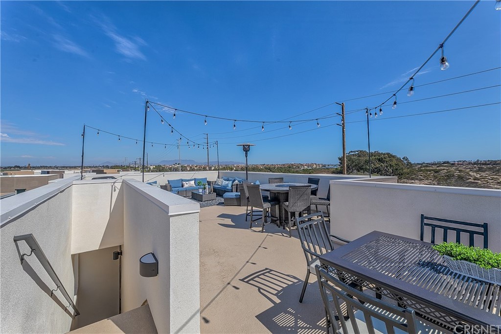 1051 Canal Street Oxnard, CA 93035 - Photo 8 of 37 a view of a kitchen with furniture and cabinets