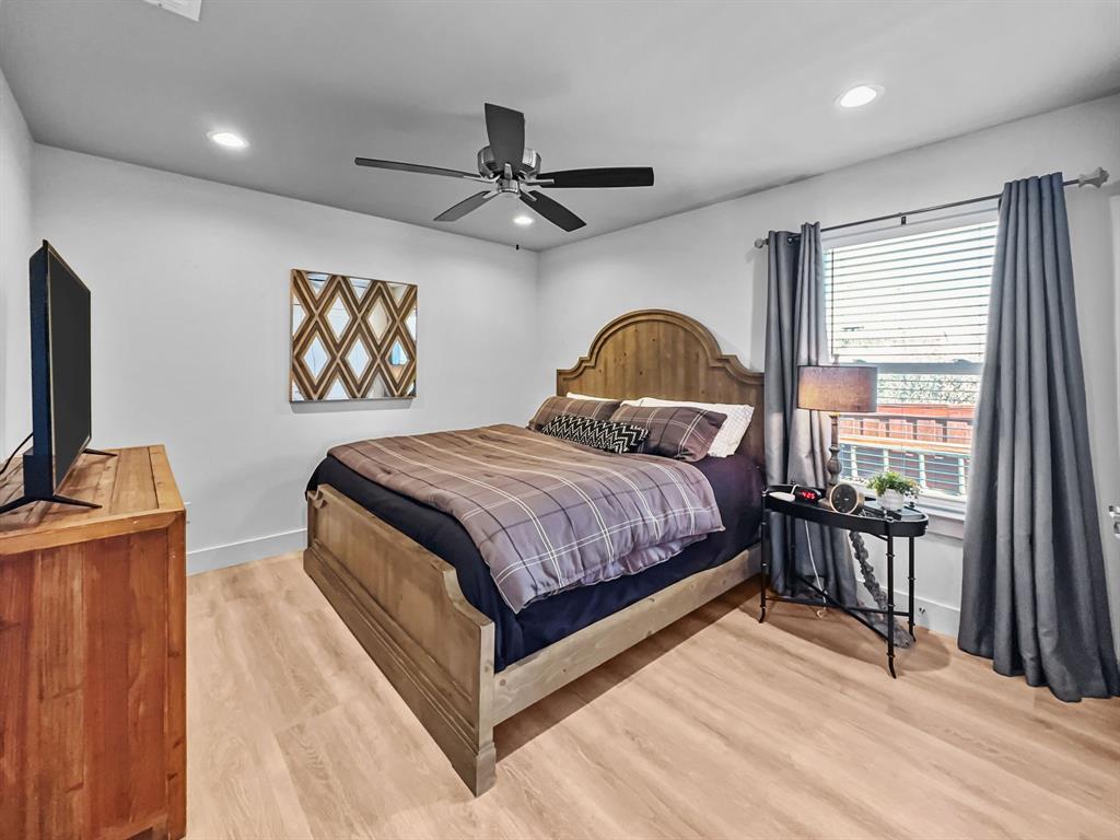 5013 Hells Gate Loop Strawn, TX 76475 - Photo 23 of 33 a bedroom with a bed and a flat screen tv