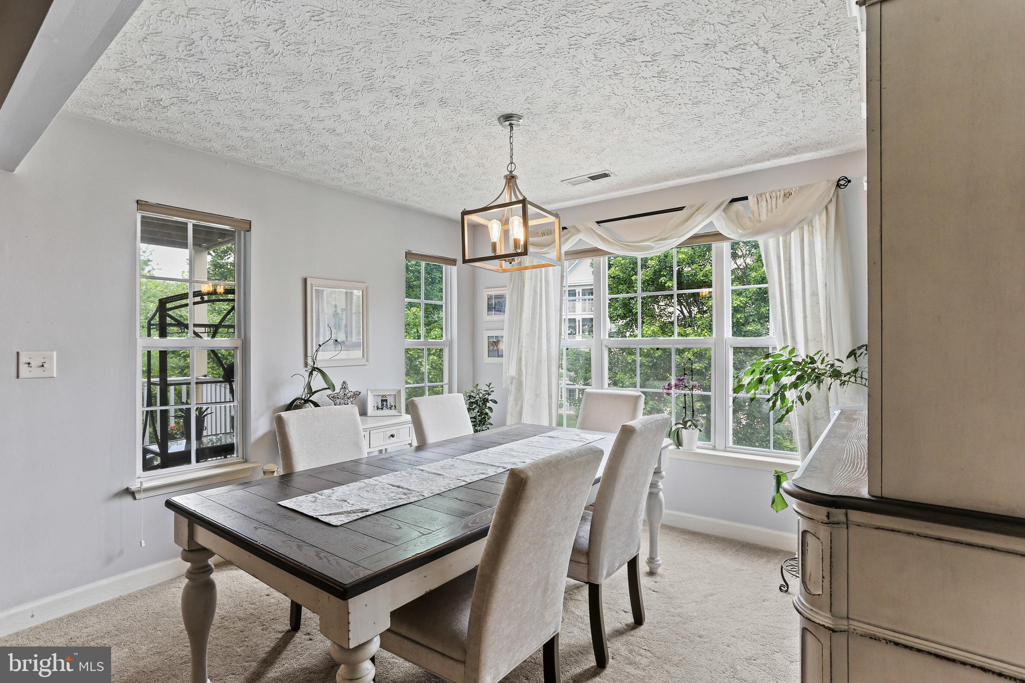 6512 Springwater Court, Unit 4302 Frederick, MD 21701 - Photo 5 of 31 Spacious Dining Room
