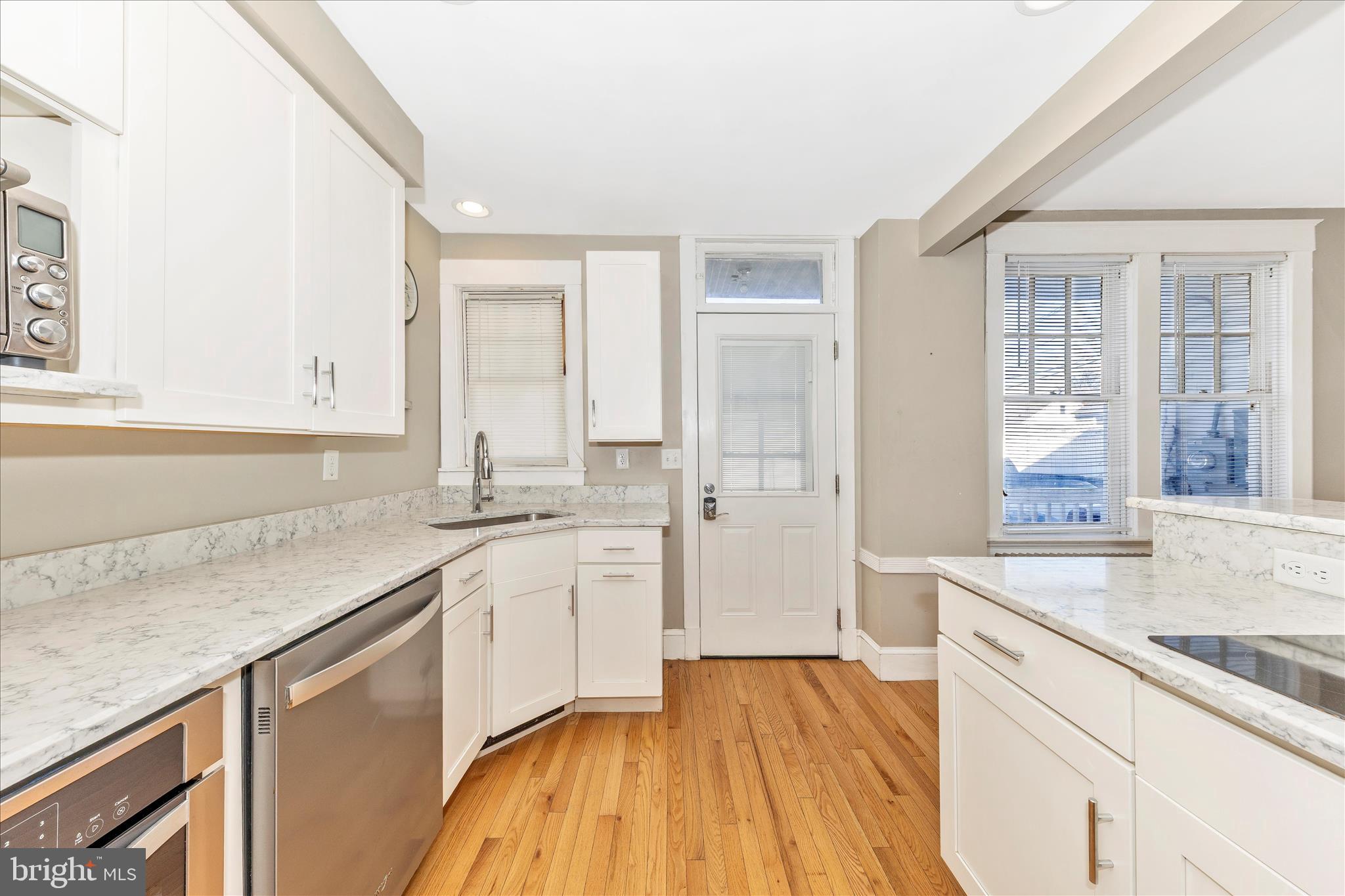 29 East 7th Street Frederick, MD 21701 - Photo 16 of 53 a kitchen with a sink stove and cabinets