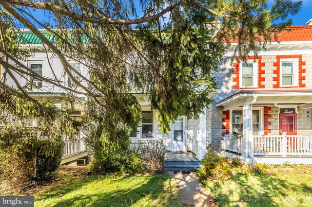 a front view of house with a yard